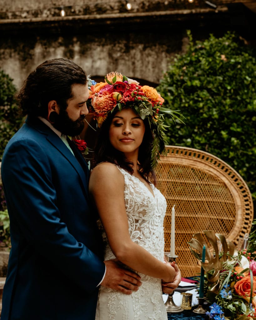 Groom whispering into his wife's ear