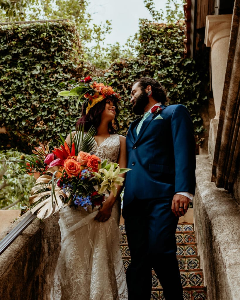 Tropical paradise bride and groom smiling at eachother in Sedona, Arizona