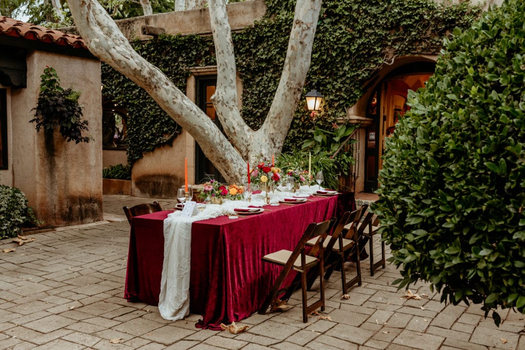 Reception table setup for courtyard reception dinner