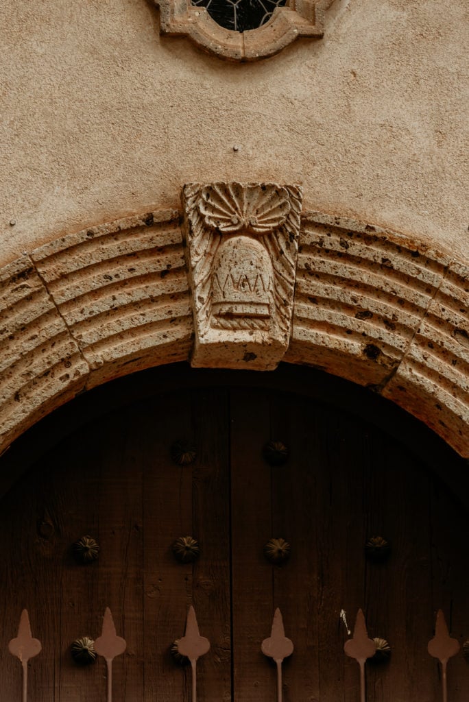 Stone ornamentation above Tlaquepaque chapel doorway