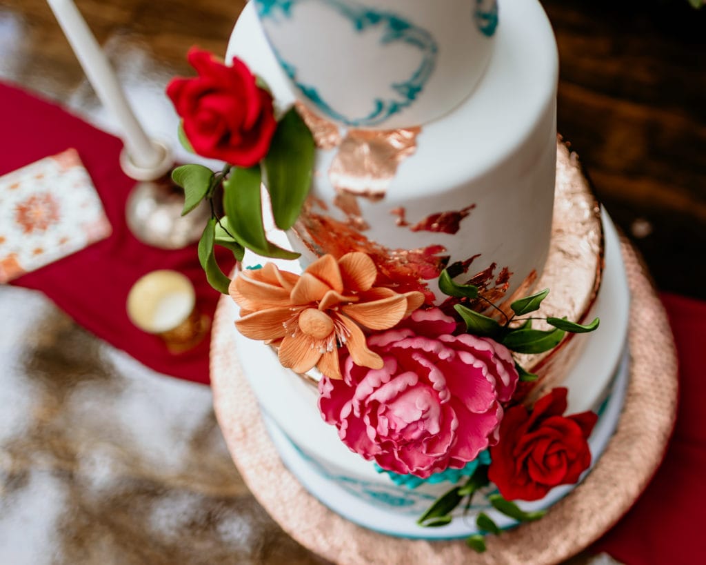 Incredible 3 tiered cake with colorful edible fowers