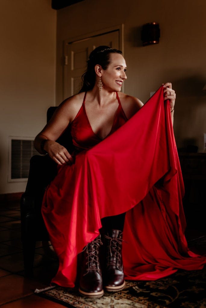 Nothing better than a bride in s satin red dress and boots!