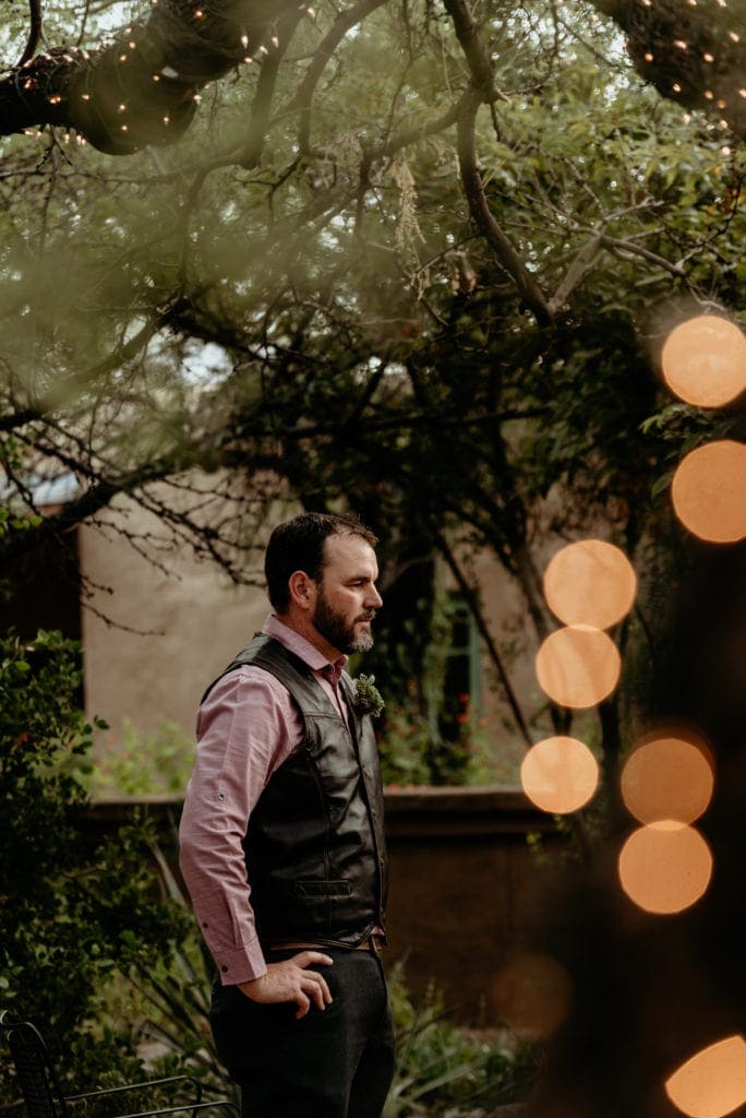 groom watching is beautiful wife to be walking down the isle at the Tucson Botanical Gardens
