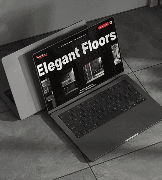 Laptop displaying Elegant Floors website on a tiled floor background.