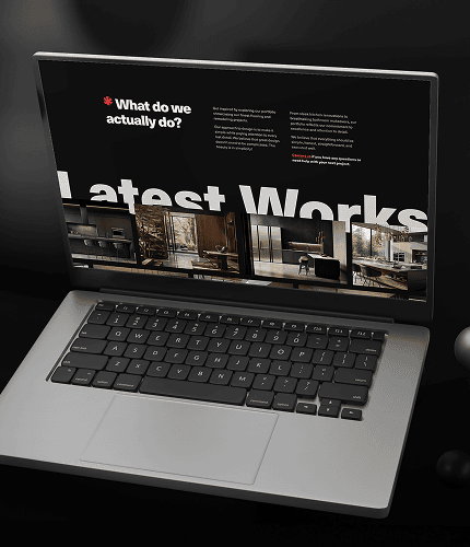 Laptop displaying Team Force Solutions website with remodeling project images.
