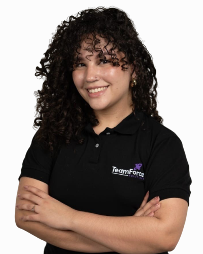 Professional woman in TeamForce Solutions uniform smiling confidently.
