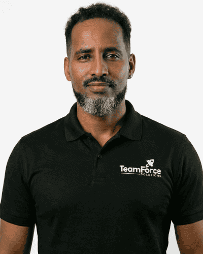 Professional man wearing TeamForce Solutions polo shirt for SEO.