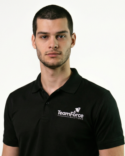 Professional staff member wearing TeamForce Solutions polo shirt.