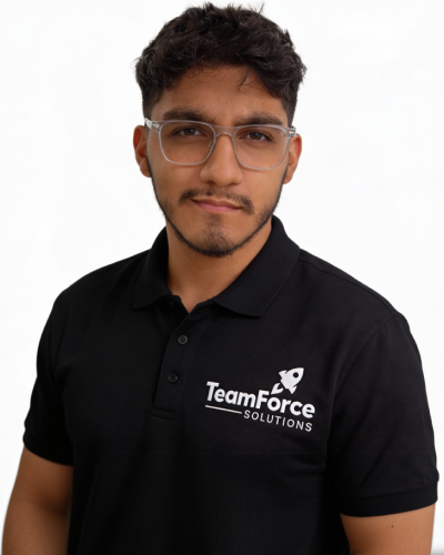 Young man wearing TeamForce Solutions polo shirt and glasses.