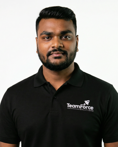 Professional team member wearing TeamForce Solutions polo shirt.