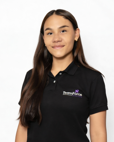 Young woman in black TeamForce Solutions polo shirt smiling at camera.