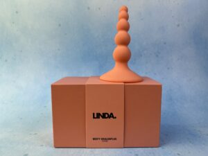 De linda. Kralen bootyplug op de verpakking.