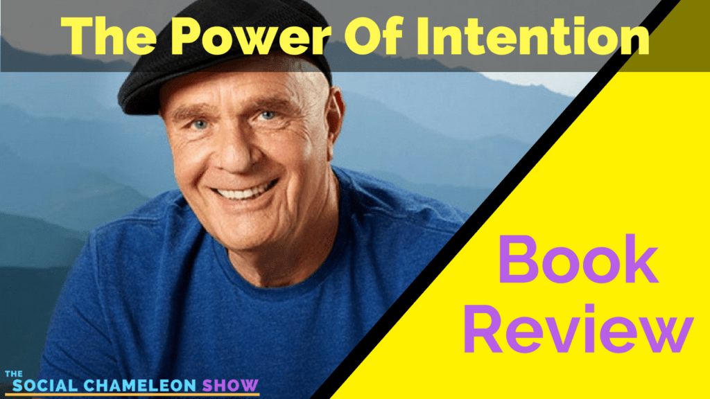 Promotional graphic for "The Power Of Intention" book review on The Social Chameleon Show, featuring an image of the author in a blue shirt with a vibrant yellow and purple diagonal split background.
