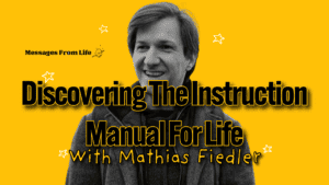 A smiling person in a dark jacket stands against a yellow background. The text reads: "Messages From Life: Discovering the Instruction Manual For Life With Mathias Fiedler," with small stars scattered around.