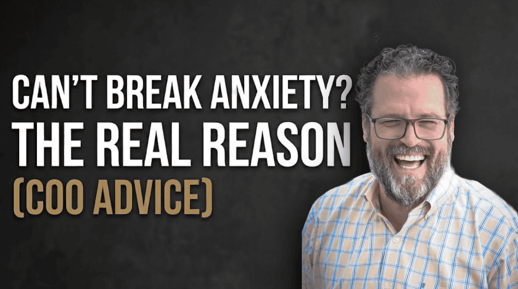 Michael Wood a smiling man with glasses and a beard stands next to the text: "Can't break anxiety? The real reason (COO advice)" on a dark background.