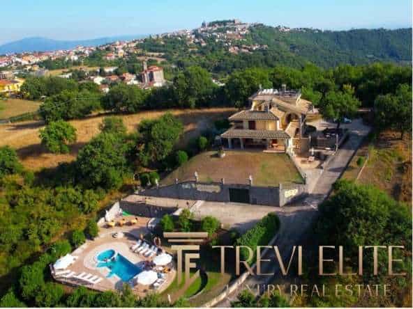 The aerial view of a luxury villa in the countryside.