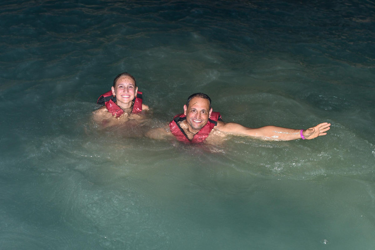Punta Cana Two people enjoying a swim in the Caribbean Sea with life jackets in Punta Cana.