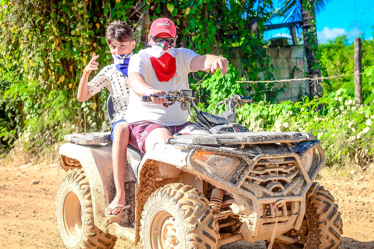 Punta Cana Kids riding ATV in Punta Cana jungle adventure, fun outdoor activity for families.