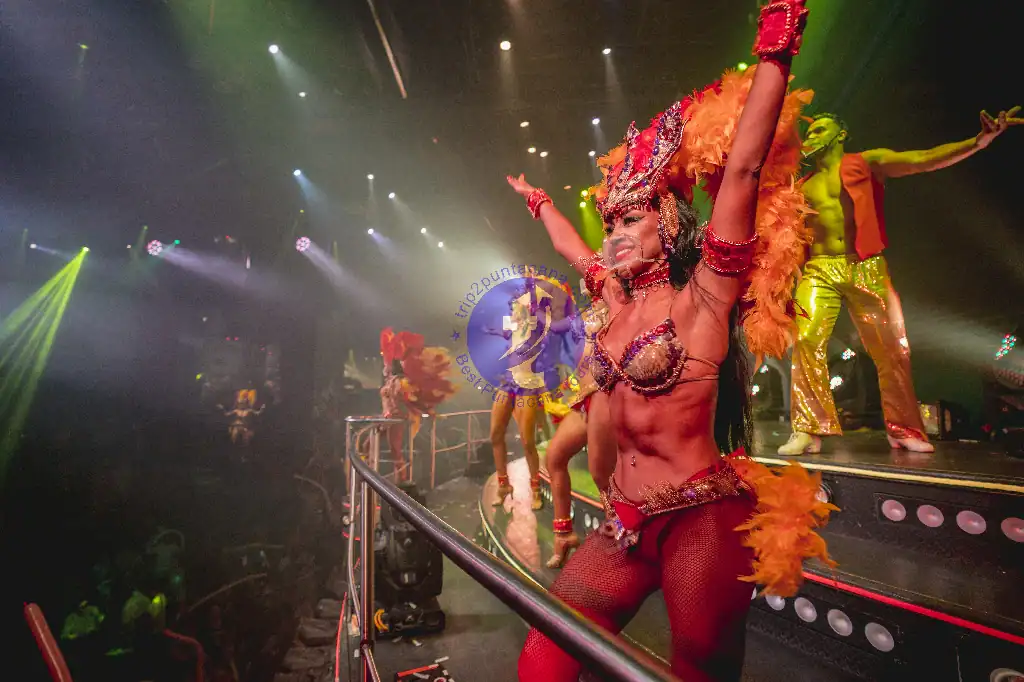 Punta Cana Colorful dancer in elaborate costume performing on stage in Punta Cana nightlife scene.