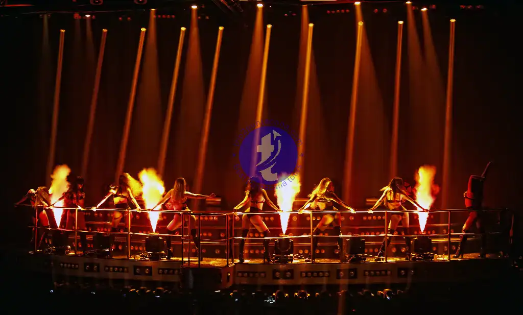 Punta Cana Fire performers on stage during a lively Punta Cana show with flames and dramatic lighting.