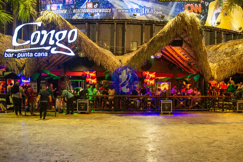 Punta Cana Vibrant Congo Bar in Punta Cana with lively crowd and colorful lighting.
