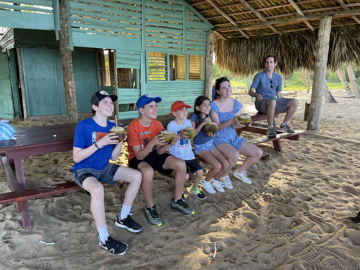 Punta Cana Punta Cana tour excursion Dominican Republic with family enjoying traditional coconut drinks.