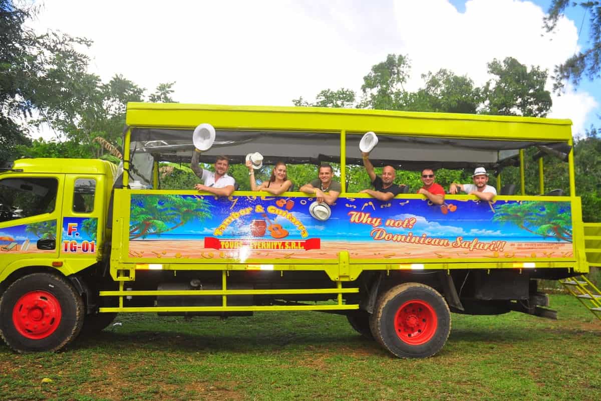 Punta Cana Passenger bus with tourists enjoying a tour in Punta Cana, Dominican Republic.