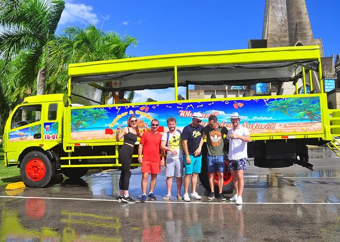 Punta Cana Bright yellow tour bus with tourists in Bavaro, Punta Cana, Dominican Republic.