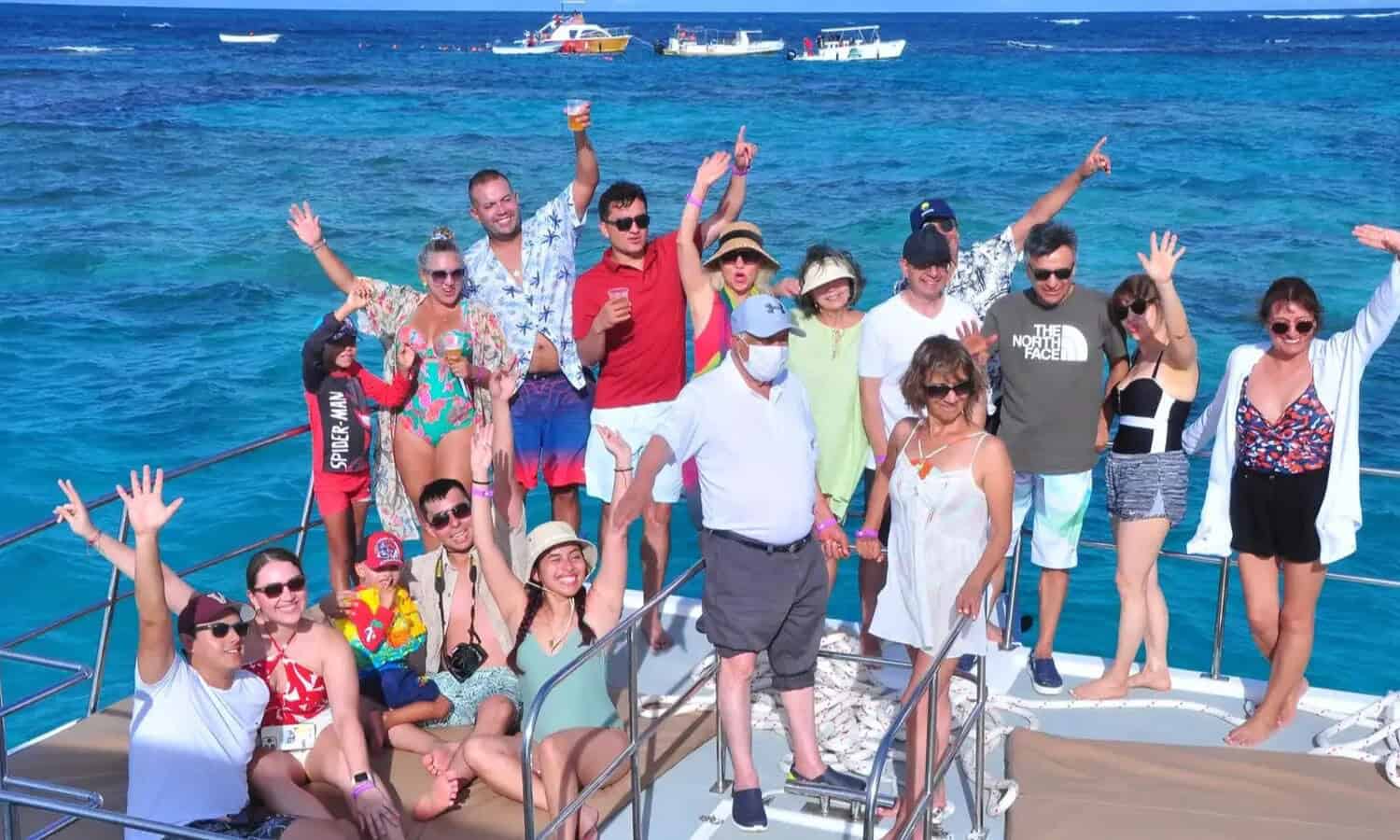 Punta Cana Happy tourists on a boat in Punta Cana enjoying a sunny day.