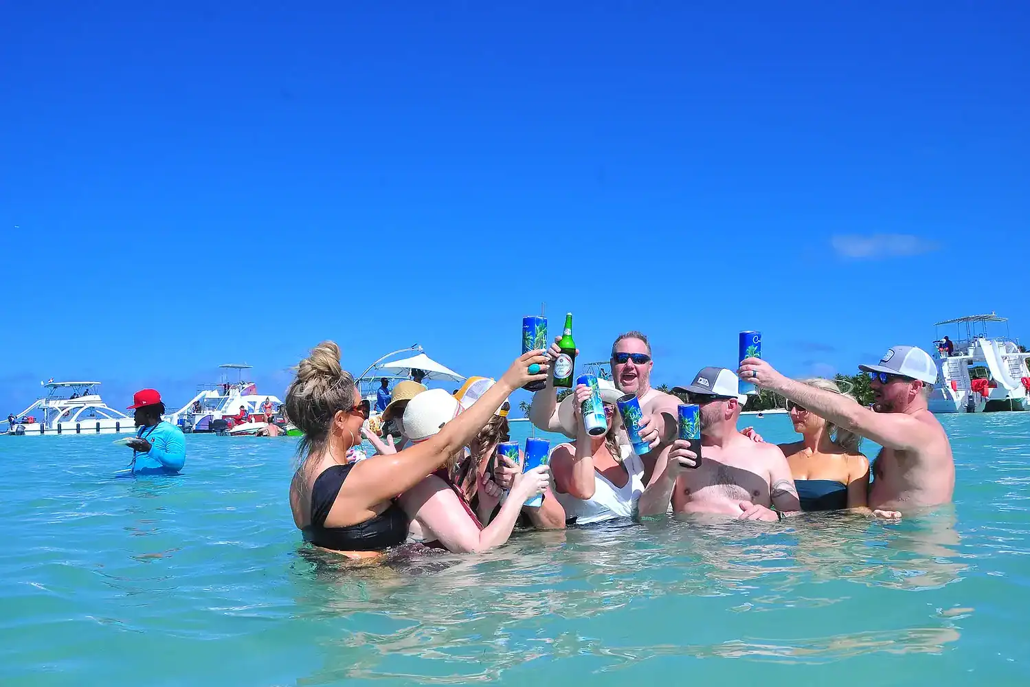 Punta Cana Group of friends enjoying drinks during a beach celebration in Punta Cana.