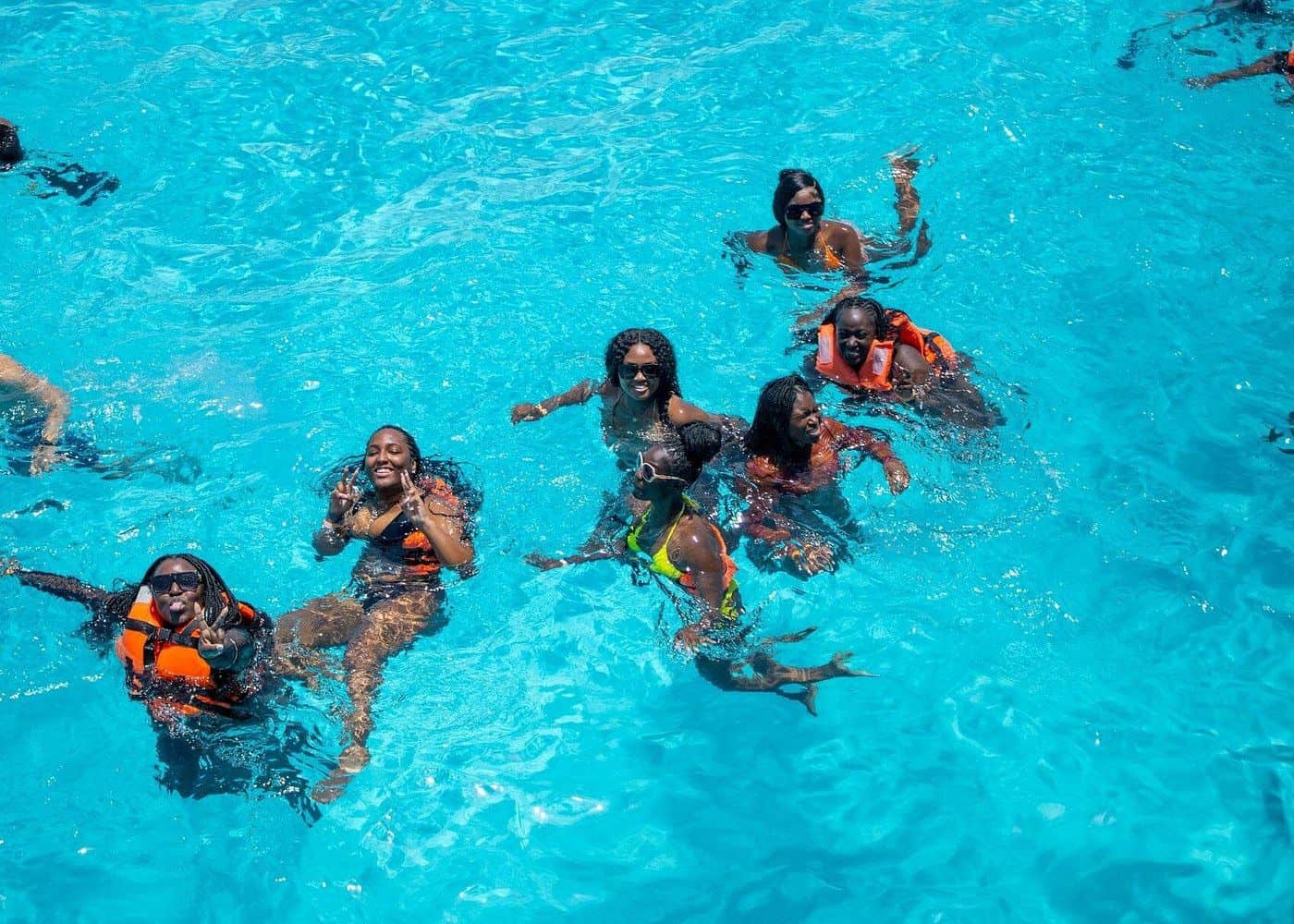 Punta Cana People swimming and snorkeling in the vibrant Caribbean sea.