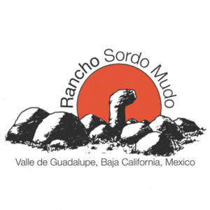 Logo of Rancho Sordo Mudo with rocks in the foreground and a red sun in the background. Text reads: "Rancho Sordo Mudo, Valle de Guadalupe, Baja California, Mexico.