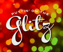 Text "Puttin' on the Glitz" in white script over a blurred, colorful background with red, green, and yellow bokeh lights.
