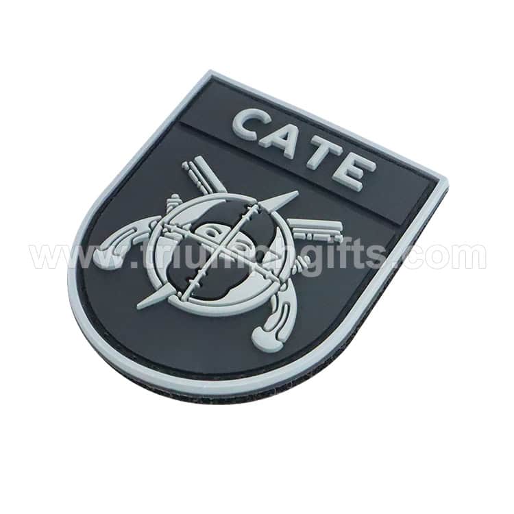 CATE military badge with combat helmet, weapons, and gear emblem, 3D rubber patch for tactical apparel and gear enthusiasts.