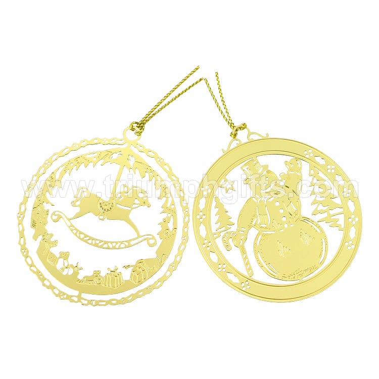 Golden Christmas themed metal ornaments featuring Santa Claus and a child in a winter landscape suitable for holiday decoration or gifting. Perfect for custom holiday promotional products.