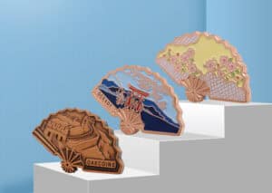 Vibrant custom fan-shaped enamel pins featuring iconic landmarks and floral designs, perfect for promotional gifts, awards, or collectibles. Showcase your brand with personalized craftsmanship.