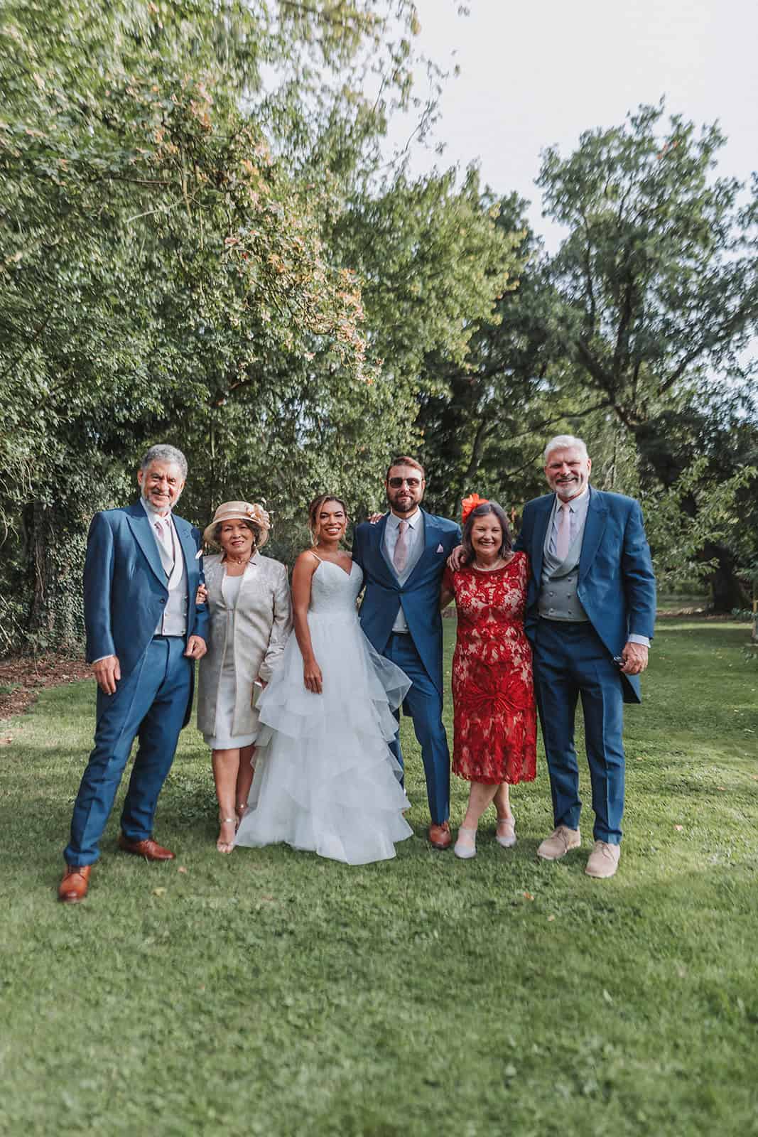 Natural candid of guests raising glasses during evening reception – Norfolk wedding photography