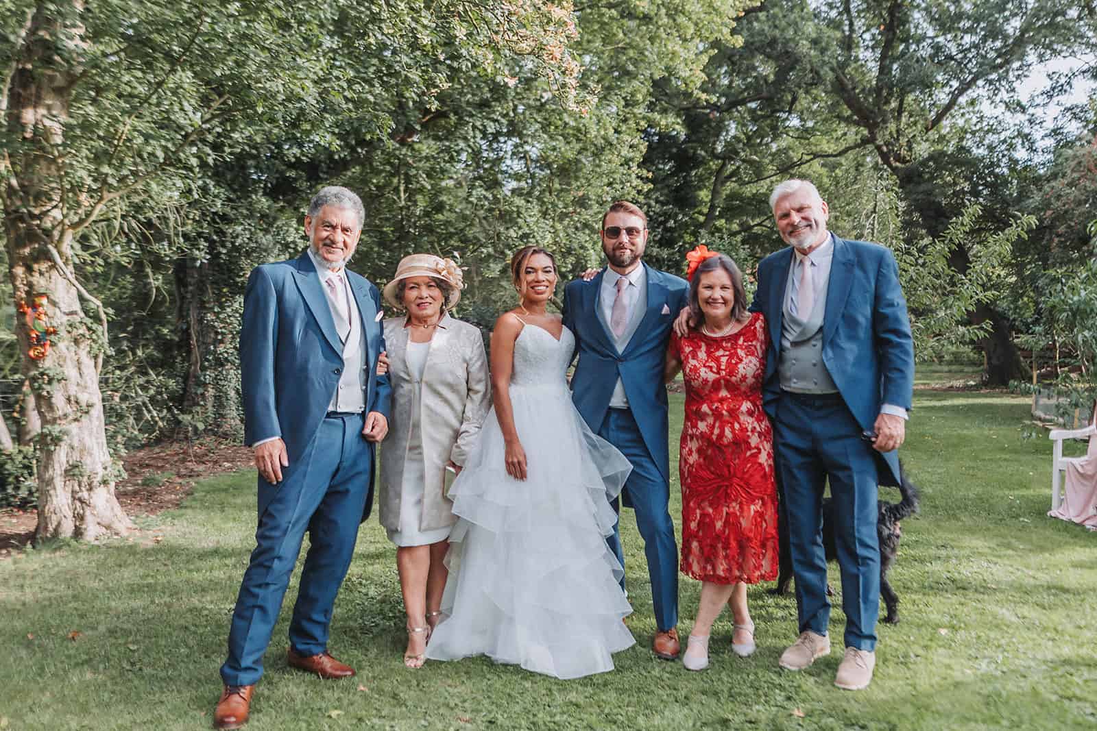 Natural candid of guests raising glasses during evening reception – Norfolk wedding photography