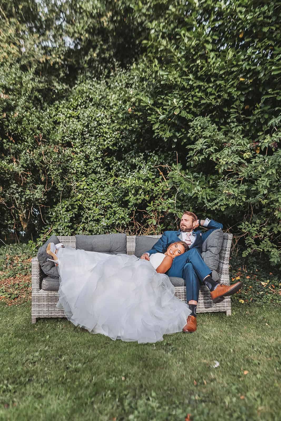 Candid moment of Milla and James walking hand in hand during their Norfolk wedding – captured by Xiarm Films & Photography