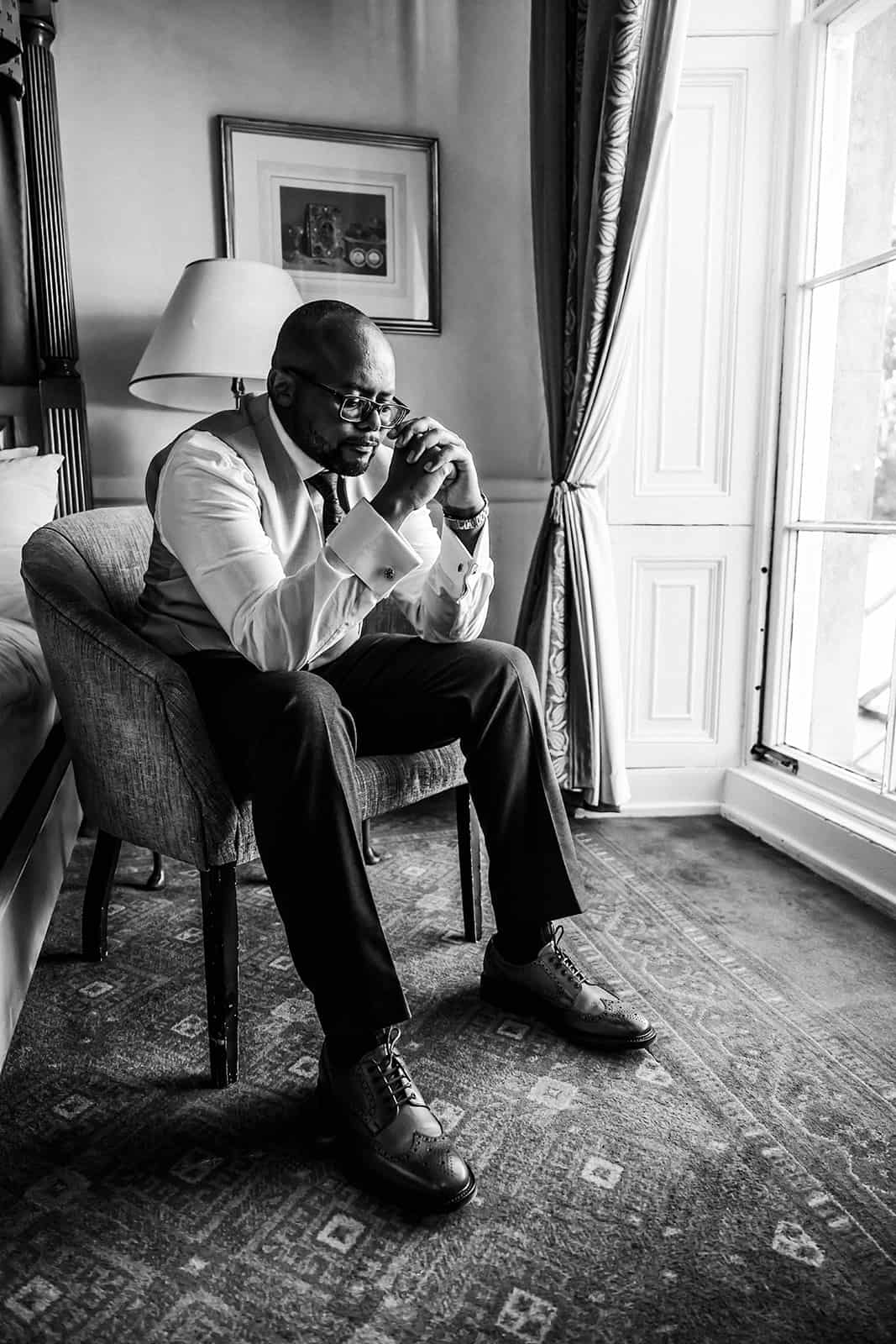 Bride and groom share candid moment at multicultural Haycock Manor wedding