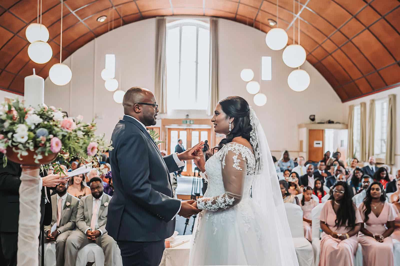 Bride and groom share candid moment at multicultural Haycock Manor wedding