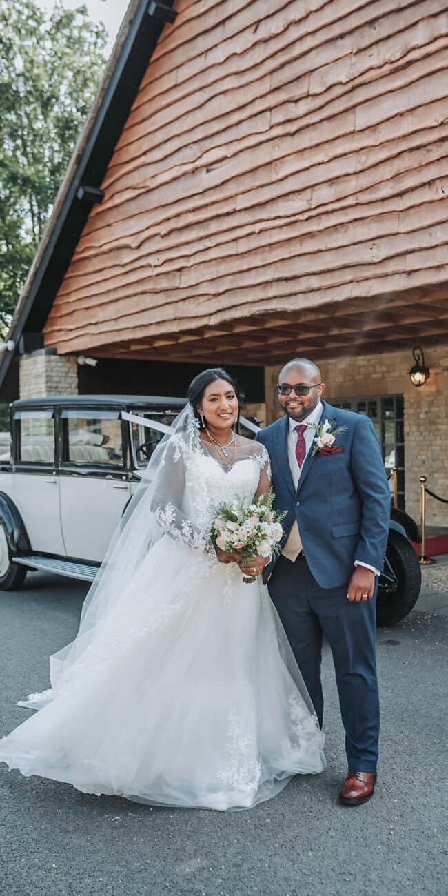 Bride and groom share candid moment at multicultural Haycock Manor wedding
