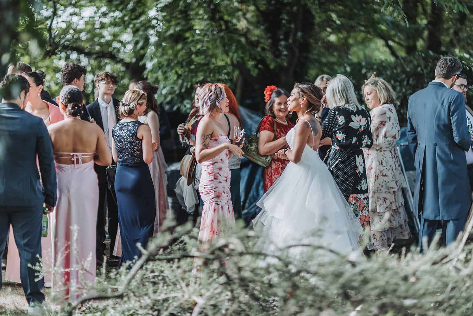 Guests arriving for a relaxed outdoor wedding in Norfolk countryside