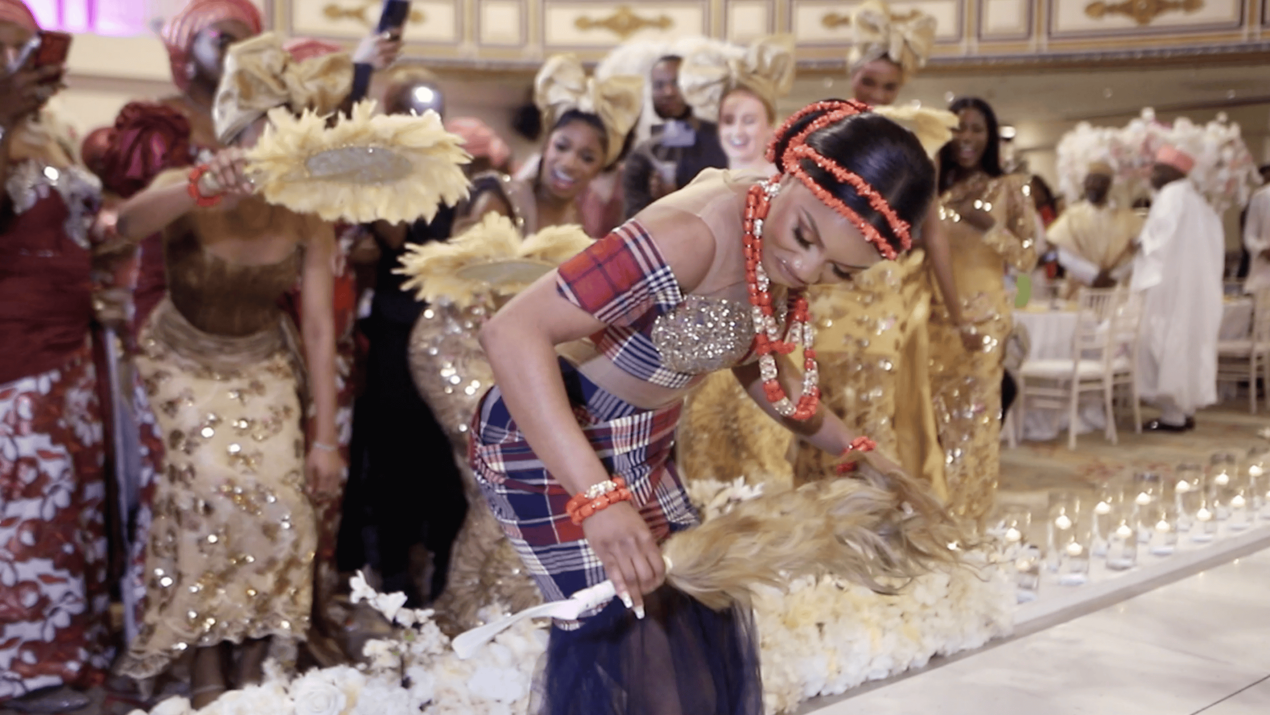 London Wedding Videographer capturing a bride dancing during a luxury Nigerian wedding at The Royal Regency, London
