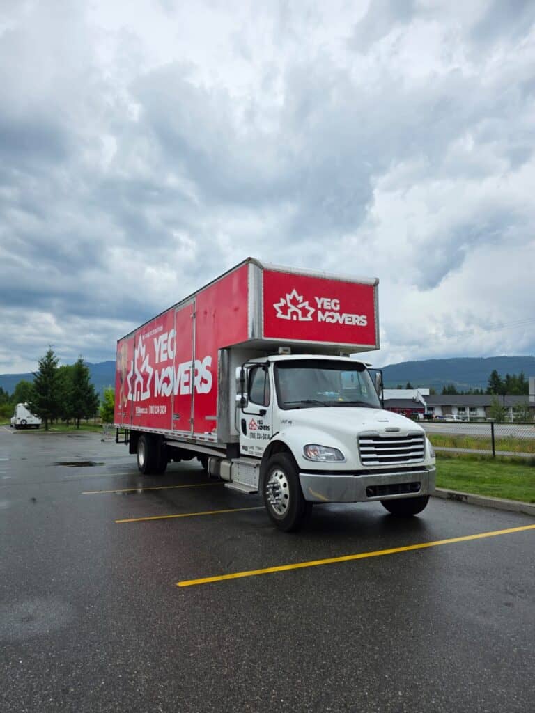 Moving truck with YEG Edmonton Movers logo for long-distance relocations.