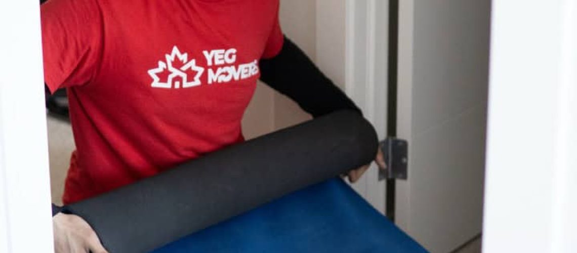 Edmonton mover preparing packing materials for a smooth move.