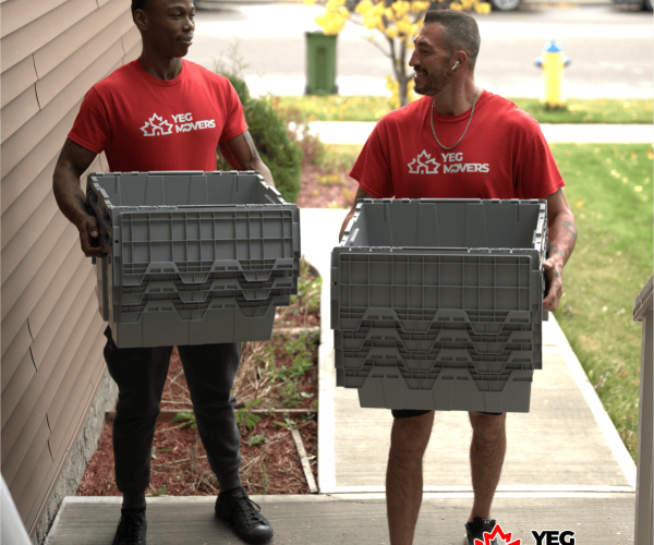 Moving helpers with boxes outside home | YEG Edmonton Movers.