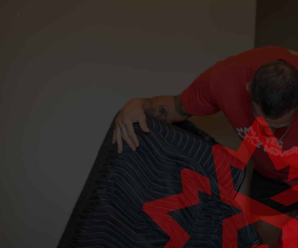 Professional moving team packing furniture and boxes.