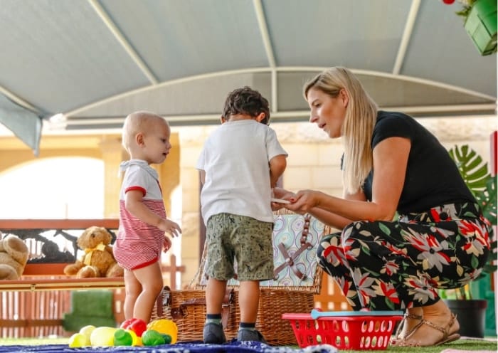 Teddy Bear Nursery teacher with students Teddy Bear Nursery help the transition from nursery to big school