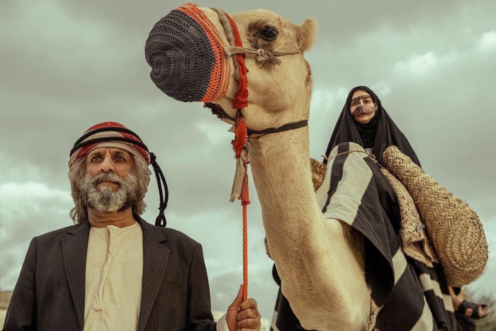 A man with a women sitting on a camel in UAE Yalla - Abu Dhabi Life Magazine Edition 19 (September 2022)